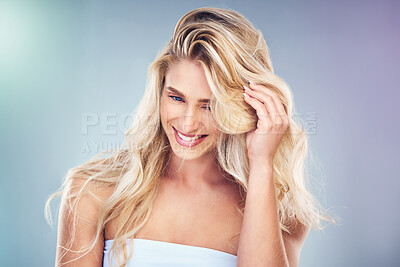 Buy stock photo Hair care, beauty and woman with a hairstyle in a studio for keratin, brazilian or volume treatment. Happy, smile and girl model with long, healthy and beautiful hair isolated by gradient background.