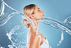 Water splash, beauty and skincare with a woman in studio for health, wellness and self care with dermatology, cosmetic and natural makeup. Model with a clean skin, body and face for healthy lifestyle