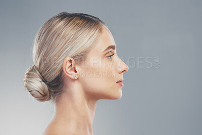 Buy stock photo Skincare, profile and side face of a woman for dermatology, wellness and natural beauty against a grey mockup studio background. Advertising, marketing and model with cosmetic health and space