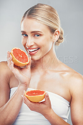 Buy stock photo Woman, face and grapefruit body wellness care for healthy skin lifestyle. Vitamin c, luxury citrus fruit and cosmetic beauty model for natural skincare glow or makeup in grey background studio