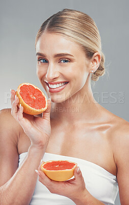 Buy stock photo Beauty, skincare and woman with grapefruit in wellness portrait, healthy skin and face care with smile against studio background. Fresh, clean with facial and vitamin c, cosmetics and natural.