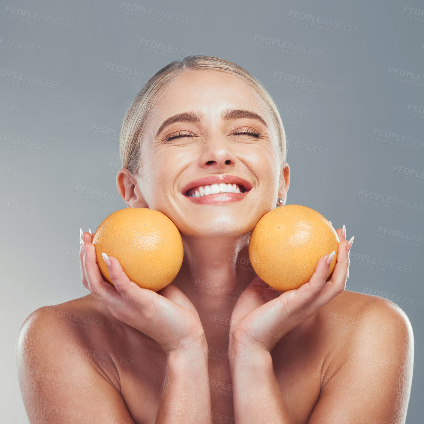 Buy stock photo Orange, skincare and woman in studio with fruit for a natural beauty facial cosmetics product with mockup space. Smile, vitamin c and happy young girl detoxing her glowing face organically to relax