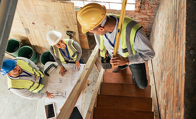 Buy stock photo Top view, construction building and team planning with blueprint, collaboration and conversation. Architecture, engineer and teamwork on site brainstorming, discussion and group project with hardhat.