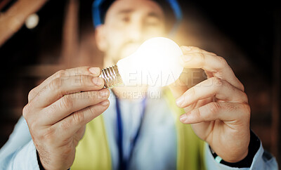 Buy stock photo Idea, light and man engineer holding a lightbulb for vision, innovation and construction. Contractor, construction worker and designer lights for a maintenance project with an architect and bulb