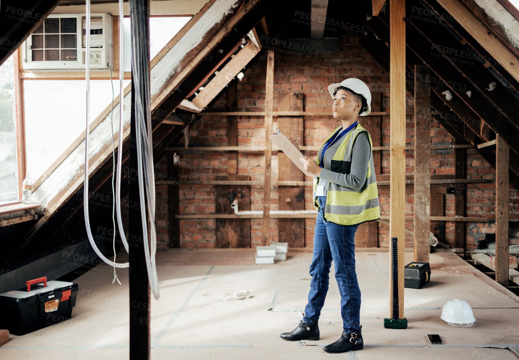 Buy stock photo Construction, building and engineer with a black woman architect planning a development project on a building site. Construction worker, architecture and engineering with a female builder at work