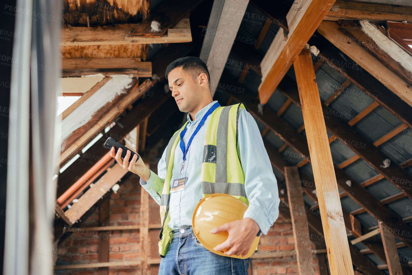 Buy stock photo Building, engineering and construction worker with phone in hand texting, typing and online. Technology, construction and architect, engineer or contractor in building site on internet on smartphone