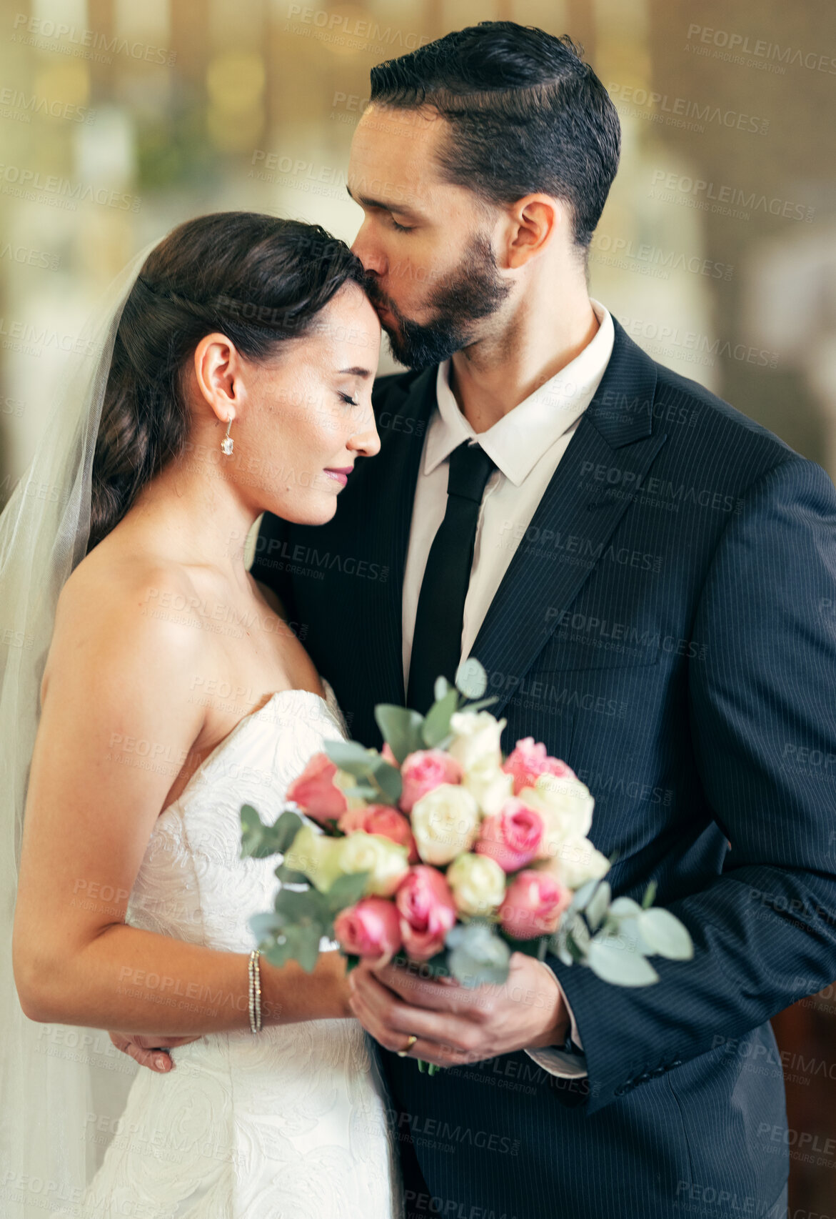 Buy stock photo Wedding, couple and forehead kiss with love while holding a bouquet of flowers for marriage, walking down the isle and marry. Bride, groom and newlywed people happy together after a celebration event