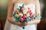 Bride, hand and rose bouquet, flowers and wedding decoration with plants on marriage ceremony day. Flower, hands and woman in dress holding plants for marriage event with scent, fragrance and beauty