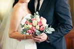Flower bouquet, wedding celebration and couple together for commitment, love and marriage of bride and groom. Flowers in hands of young man and woman at union event with trust, support and care