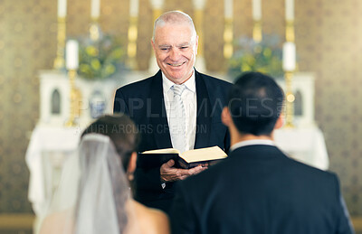 Buy stock photo Wedding, priest and couple at the altar saying vows while getting married in a church for commitment, love and care. Birde and groom or man and woman with a pastor for marriage, support and religion