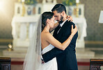 Wedding dance, love and couple dancing together with a hug after getting married at celebration reception for event. Bride, groom and marriage commitment in Christian church, a suit and wedding dress