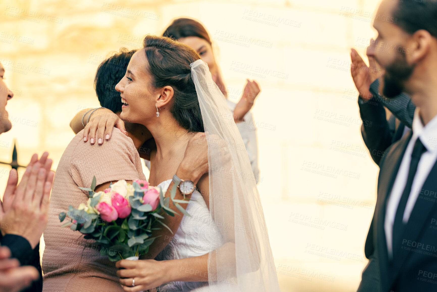 Buy stock photo Wedding, marriage and bride hug family guests with a smile while leave church with groom after marrying, celebration and event to celebrate love. Romance, commitment and happy married couple together