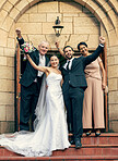 Wedding, bride and groom with parents, hands up by stairs, church and happiness at excited celebration. Marriage, couple and parents with flowers, portrait and happy family for love, smile or happy