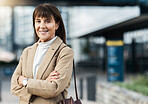 Senior portrait of confident business woman with smile, crossed arms and happy with career growth, job or success. Pride, women empowerment and experienced worker satisfied with building development