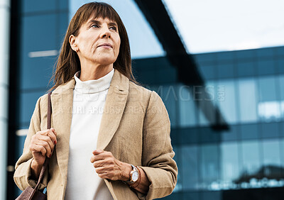 Buy stock photo City, office and senior business woman waiting for a lift, taxi or cab outside the corporate building. Serious, professional and elderly manager standing alone outdoors in the street in a urban town.