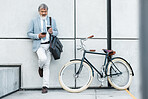 Businessman, phone and coffee with bicycle in city on social media, web or internet browsing. Tech, bike or senior manager drinking tea while on 5g smartphone app, networking or text message on break