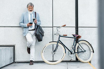 Buy stock photo Businessman, phone and coffee with bicycle in city on social media, web or internet browsing. Tech, bike or senior manager drinking tea while on 5g smartphone app, networking or text message on break