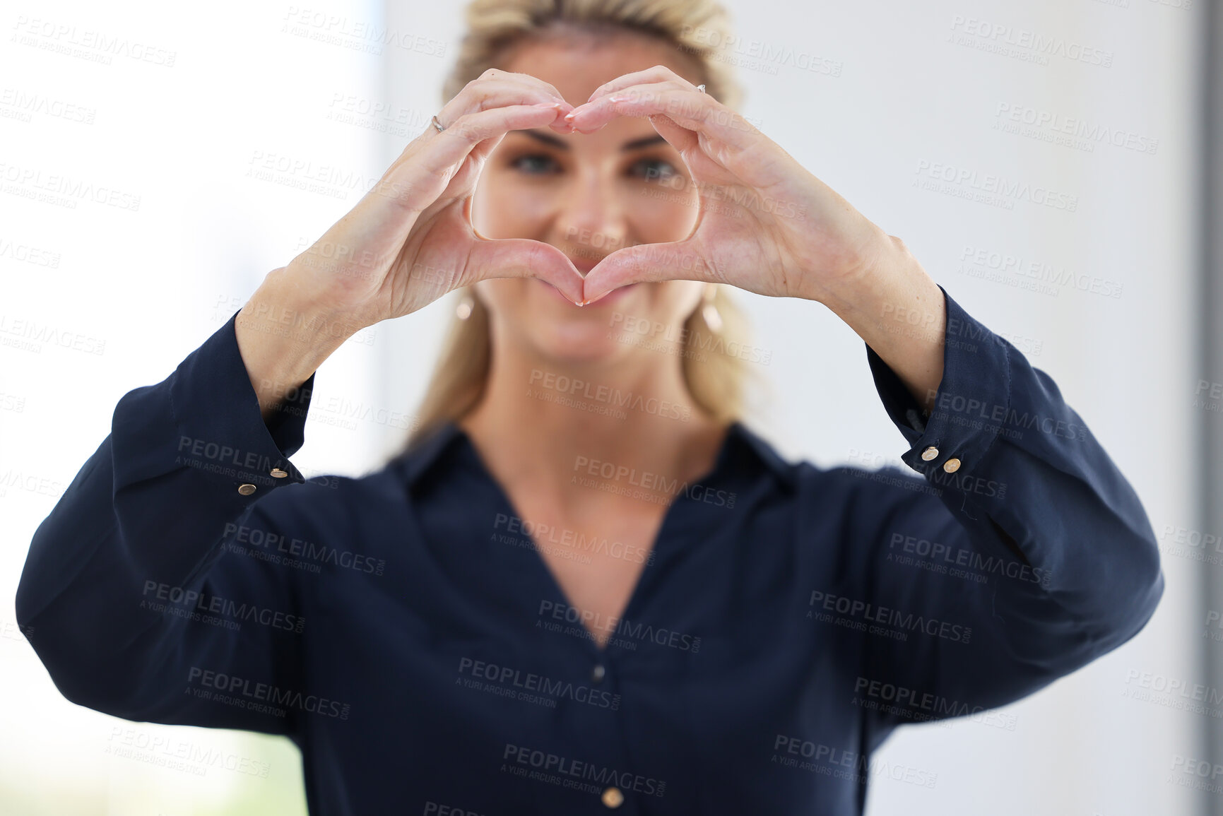 Buy stock photo Portrait of office worker, hands in heart shape and employee satisfaction in the workplace, happy staff and company solidarity. Professional business woman, love symbol and corporate work commitment 