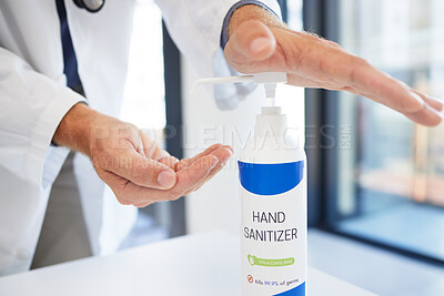 Buy stock photo Doctor, hands and sanitizer for hygiene protection against virus, disease or bacteria at the workplace. Hand of healthcare professional using sanitary equipment for medical wellness and clean safety