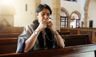 Faith, senior woman and in church with rosary for prayer, worship God and religion. Religious, spiritual and elderly female in temple or sanctuary for praying, blessing or guidance with peace or calm