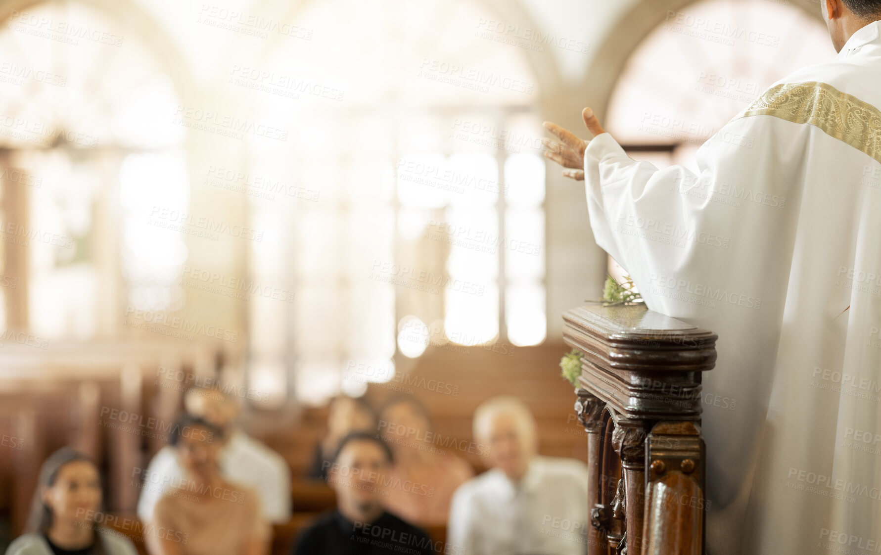 Buy stock photo Congregation, religion and faith with priest, in church and preaching sermon, speaking and spiritual. Leadership, talking and connect with people, believers and in chapel for forgiveness or guidance.