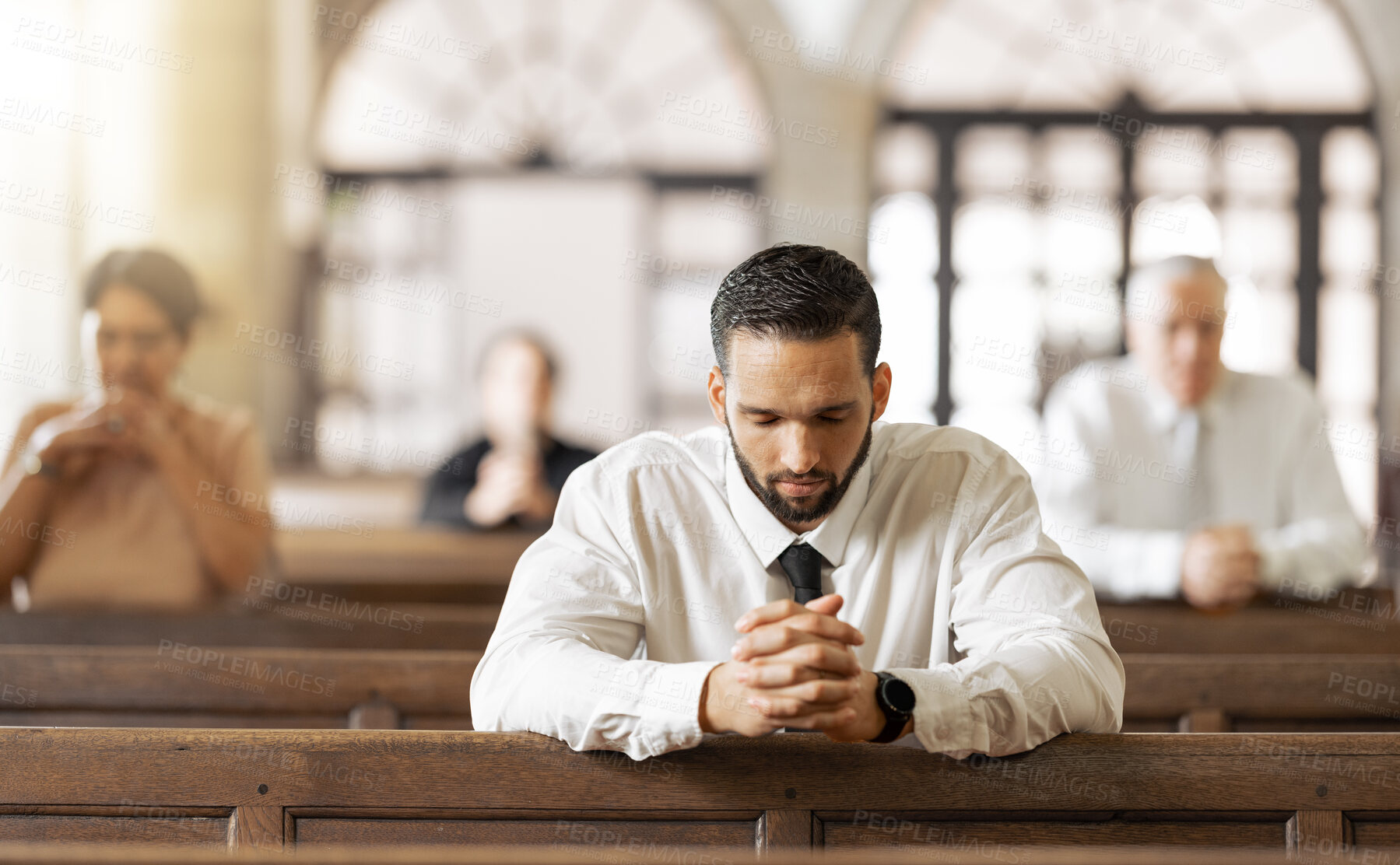 Buy stock photo Church, prayer and man praying to God, worship or religion in cathedral. Faith, spiritual and christian community in chapel or sanctuary worshipping Jesus, holy praise or trust and hope in Christ.