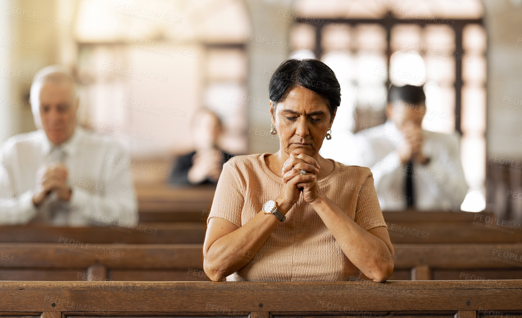 Buy stock photo Faith, woman and praying in church, religion and spiritual connect, communication or believe. Senior female, mature lady or prayer in chapel with congregation, worship or trust with gratitude or hope