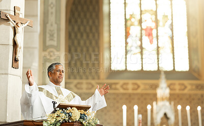 Religion, Christianity and priest speaking in church with arms raised standing by podium. Ceremony, mass and religious leader in worship, preaching and prayer for congregation in spiritual building