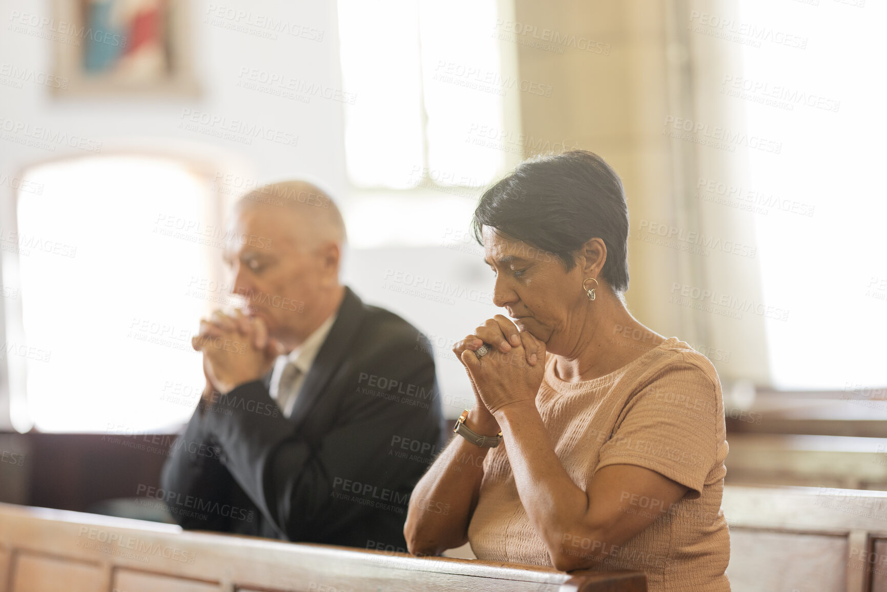 Buy stock photo Senior couple, christian and pray in church, religion and spiritual for help, respect and thank you to God in service. Elderly man and woman in prayer, praying and faith in chapel, service and trust