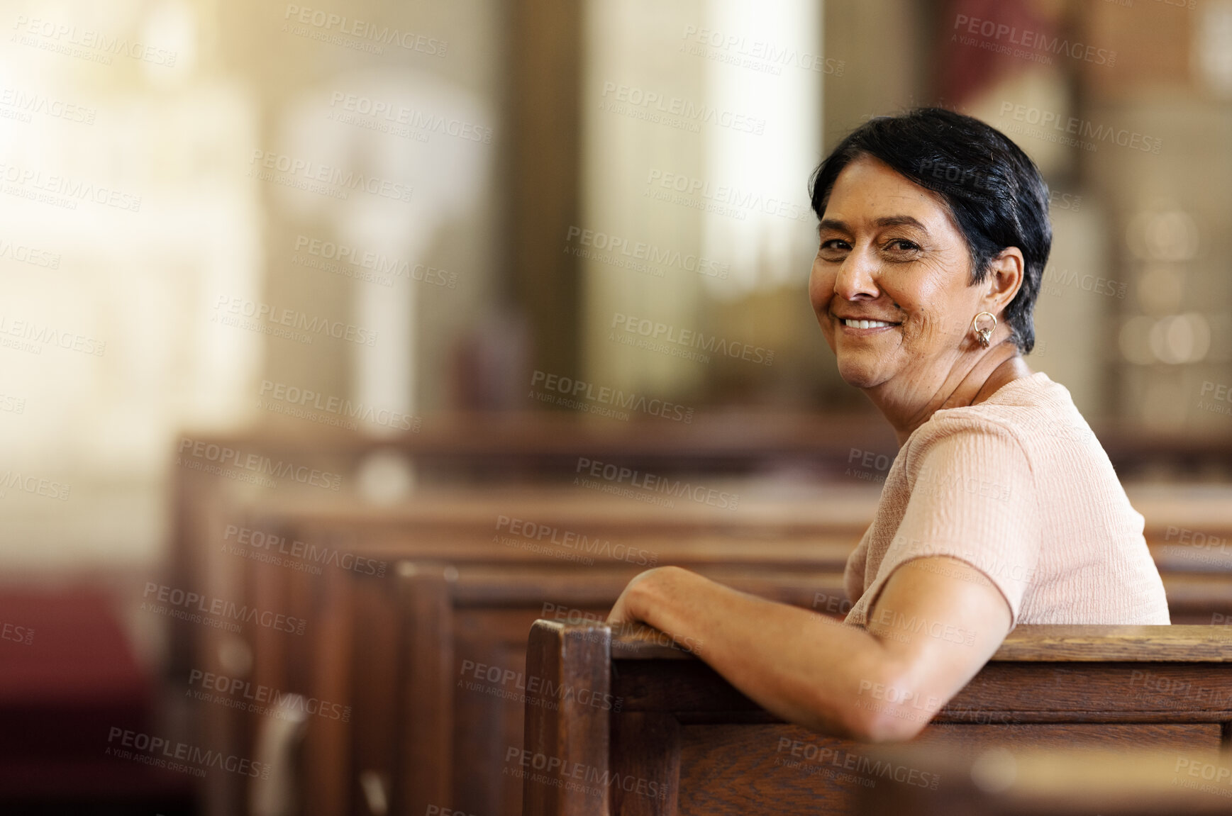 Buy stock photo Senior woman, christian and happy in church, spiritual and religion after service, smile and lifestyle. Elderly female smile, portrait and empowerment while sitting in wood bench in catholic chapel