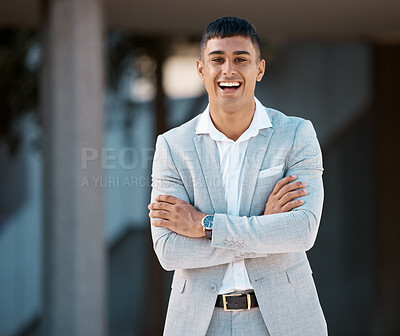 Buy stock photo Happy, smile and portrait of young businessman standing outside his modern office building. Happiness, professional and corporate employee from Brazil smiling with his arms crossed in the urban city.