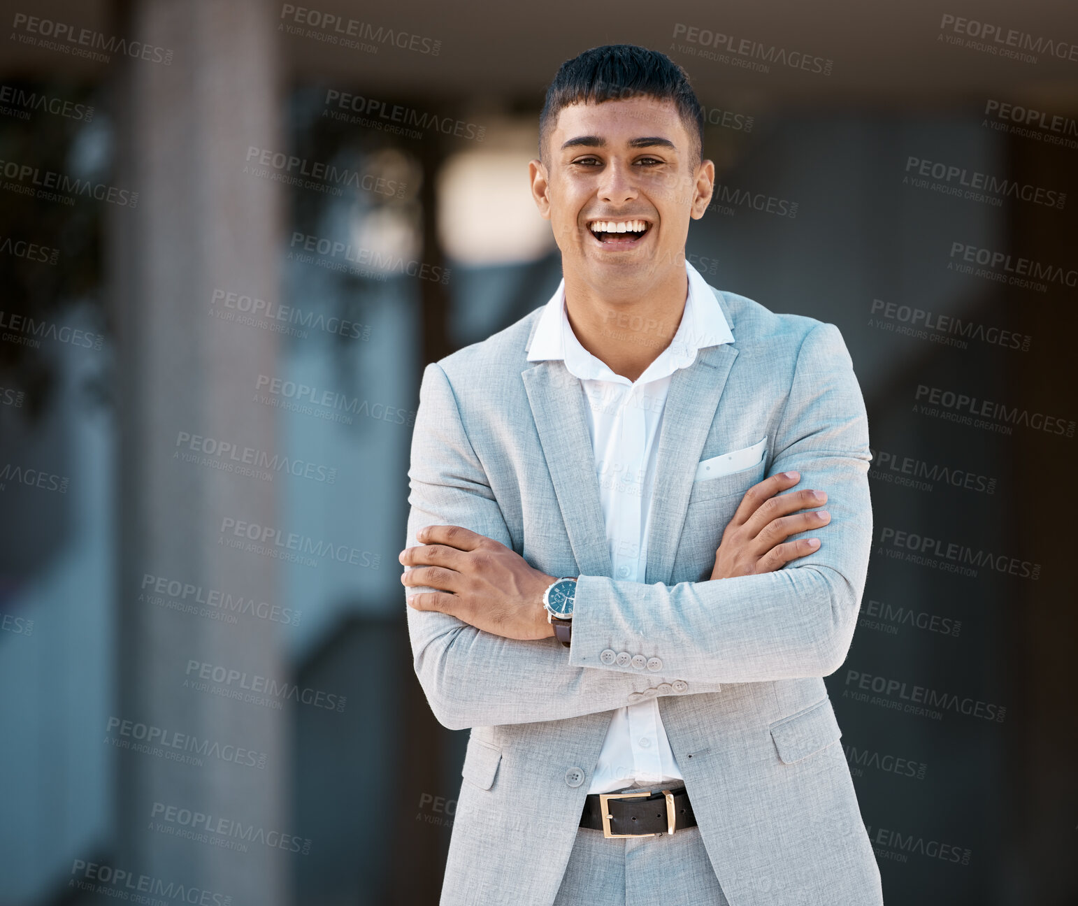 Buy stock photo Happy, smile and portrait of young businessman standing outside his modern office building. Happiness, professional and corporate employee from Brazil smiling with his arms crossed in the urban city.