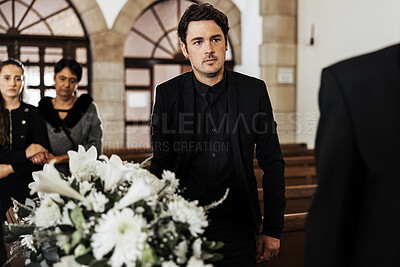 Buy stock photo Funeral, death and grief with a man pallbearer carrying a coffin in a church during a ceremony. Flowers, suit and loss with a male holding a casket while walking through a chapel for mourning