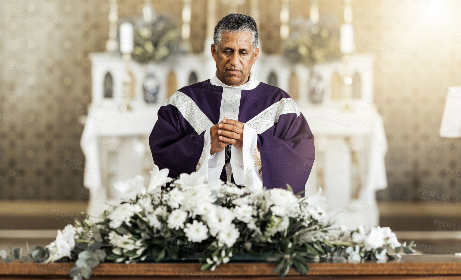 Buy stock photo Funeral, prayer and pastor in a church for worship, farewell and praying over a coffin. Pray, death and church service by a priest talking, offering comfort and spiritual guidance at funeral service