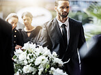 Death, funeral and carry coffin with family mourning, sad and depressed for grieving time. Grief together, mental health and man holding casket for church service, memorial and difficult for loss. 