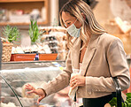 Woman, covid and grocery shopping for healthy food, dairy product or retail refrigerator stock in virus compliance. Face mask, supermarket or customer by store fridge for wholesale or wellness salad