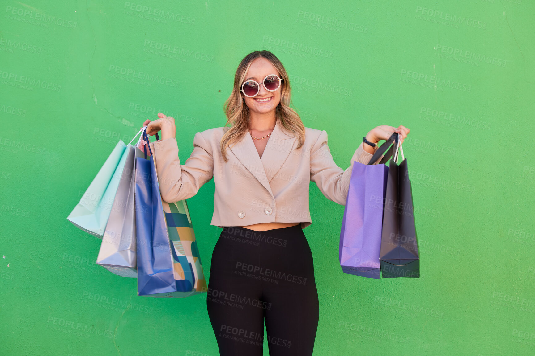 Buy stock photo Fashion, shopping bag or woman in studio with green background for retail, luxury or designer gift or clothes. Portrait, model or rich girl happy for discount, smile or retail boutique product brand