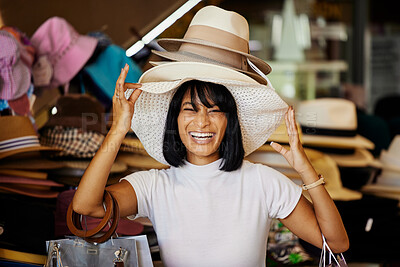 Buy stock photo Woman, hats and smile of a black woman shopping at a retail store with a comic smile. Portrait of a funny and happy sales customer laughing from luxury shop experience in a mall or clothes boutique 