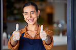 Thumbs up, small business and shop, cafe or restaurant owner feeling happy, pride and ready for service at door of her store. Portrait of happy entrepreneur with hand sign for goal or success to open