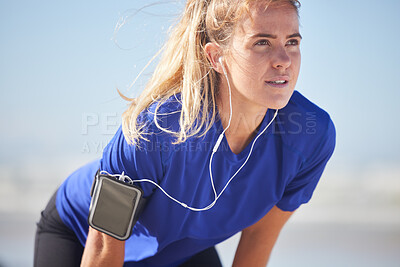 Buy stock photo Music, fitness and woman runner stop to breathe, focus and prepare body for training, exercise and cardio run in a city. Radio, exercise and sports woman relax, stretch and breathing while running