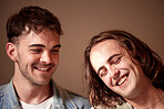 Love, happy and gay with a normal couple in studio on a brown background for lgbt inclusion or romance. Smile, relationship and homosexual with a young man and his partner bonding together inside