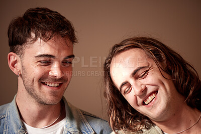 Buy stock photo Love, happy and gay with a normal couple in studio on a brown background for lgbt inclusion or romance. Smile, relationship and homosexual with a young man and his partner bonding together inside