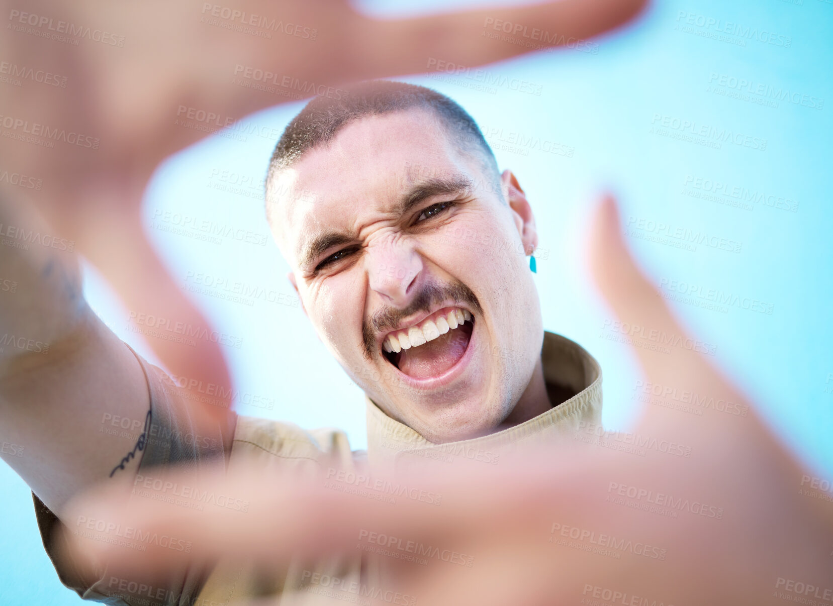 Buy stock photo Face hands frame, smile and man portrait feeling happy about beauty, fashion and skincare. Smile, comedy and silly gen z model with a aesthetic hand sign feeling happiness, creativity and funny