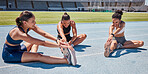 Fitness, friends or women runner stretching legs for training, exercise or workout at stadium for race, event or marathon. Motivation, sports diversity or team with wellness goal, warm up or health