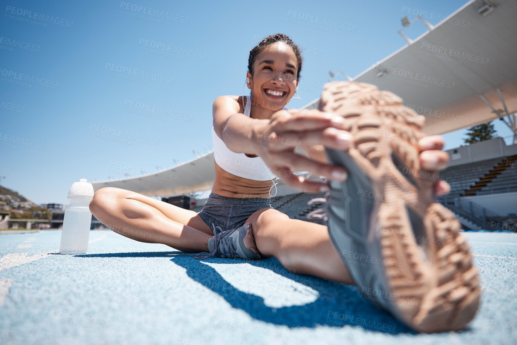 Buy stock photo Runner, stretch and woman athlete with a smile ready for running, training and sports workout. Happy, wellness and fitness of a person stretching legs on the ground outdoor for marathon or exercise