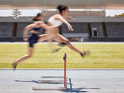 Buy stock photo Woman, sports and hurdle athletics running for exercise, training or workout at the stadium track outdoors. Fitness women athletes in competitive sport jumping over hurdles for healthy cardio outside