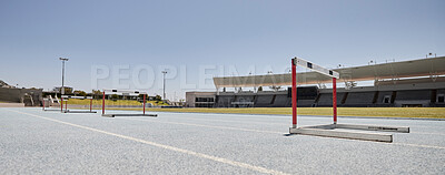 Buy stock photo Stadium, hurdles and sports event for exercise, olympics and training with no people, space and mockup. Sport, venue and hurdling workout at an empty track for workout, healthy lifestyle and venue 