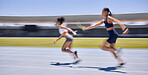 Relay race, running and sports women at a stadium for training, energy and workout. Sport, runner and baton pass on a running track by athletic team for fitness, marathon and speed performance 