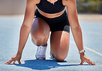 Runner start on running track for race, competition and exercise, challenge and fitness in stadium. Active, fit and closeup sports athlete ready for marathon training, fast cardio and sprint action 