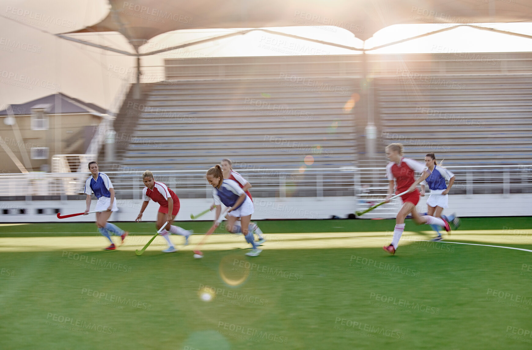 Buy stock photo Women, hockey and sports on grass field, turf and pitch for competition, games and team training in outdoor sunshine. Girls field hockey players contest, action and performance match in stadium arena